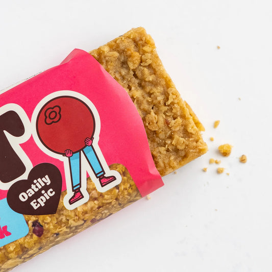 Oat bar with pink packaging featuring a cartoon character on a white background