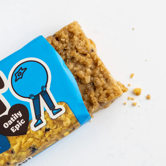 Oatmeal bar with blue packaging labeled 'Oatily Epic' on a white background