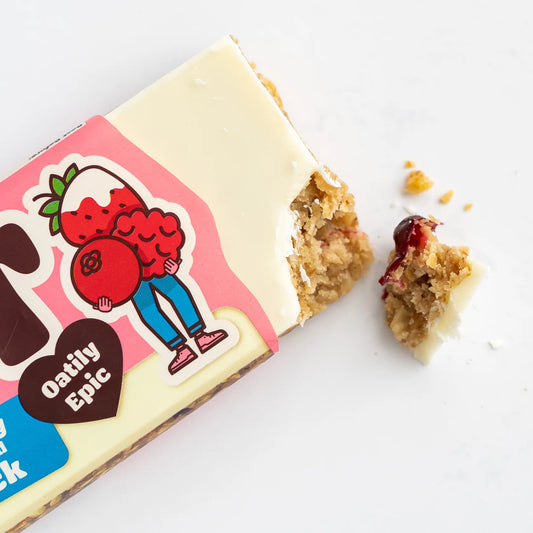 Oatly Epic snack bar with a bite taken out on a white background