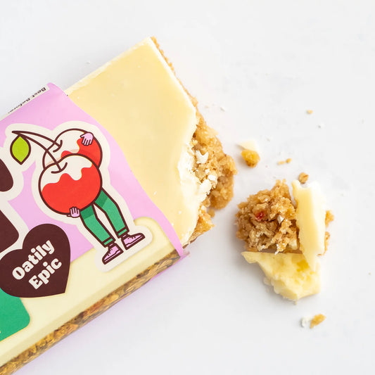 Oatly Epic snack bar with a bite taken out on a white background