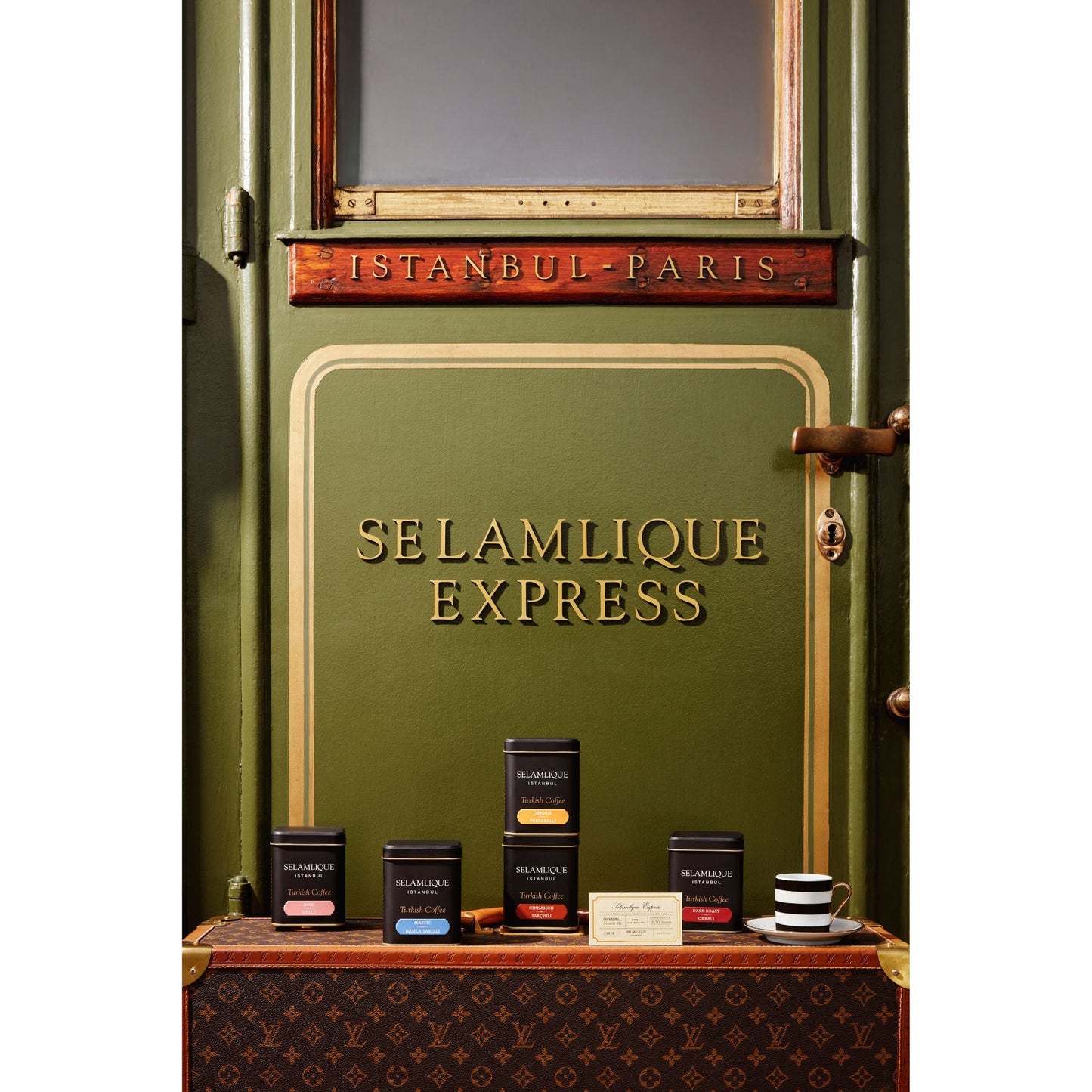 Green door with 'Selamlique Express' branding and tea products displayed below.