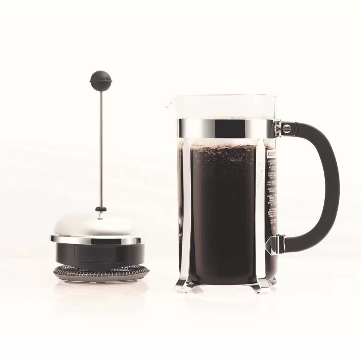 French press coffee maker with a clear container and black handle on a white background