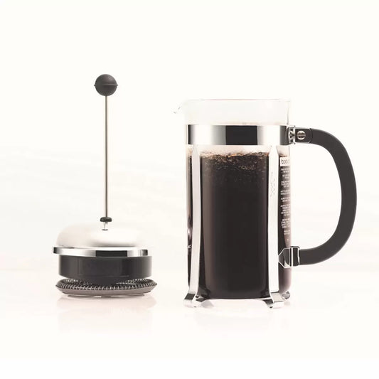 French press coffee maker with a clear container and black handle on a white background