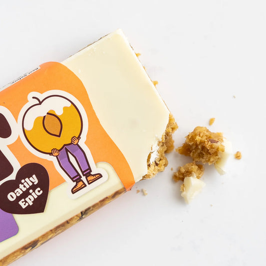 Bar of soap with cartoon character and 'Oatily Epic' text on an orange label, on a white background.