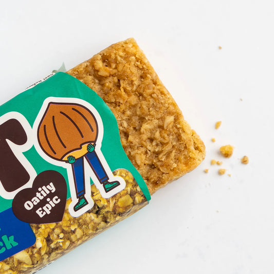 Oat bar with a green label featuring a cartoon character on a white background