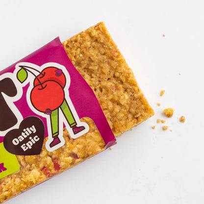 Oat bar with pink packaging featuring a cartoon character on a white background