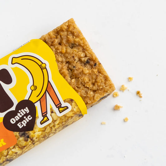 Oat bar with a yellow label featuring a cartoon character on a white background