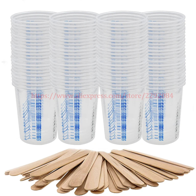 Stacks of clear plastic cups with blue markings and a set of wooden spoons on a white background.