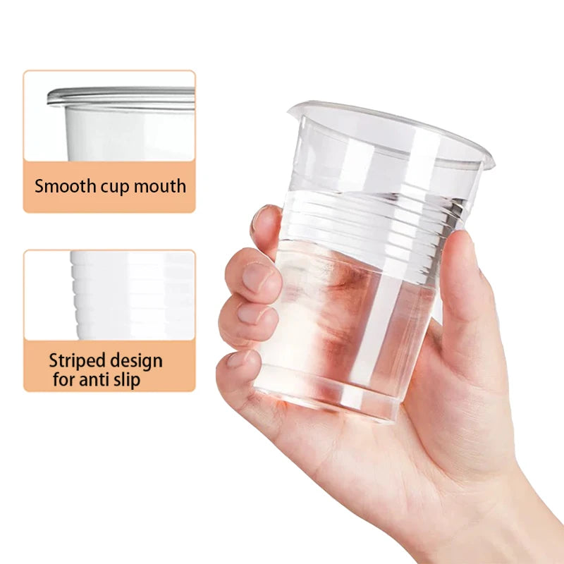 Clear plastic cup held in a hand with text on smooth mouth and anti-slip design.