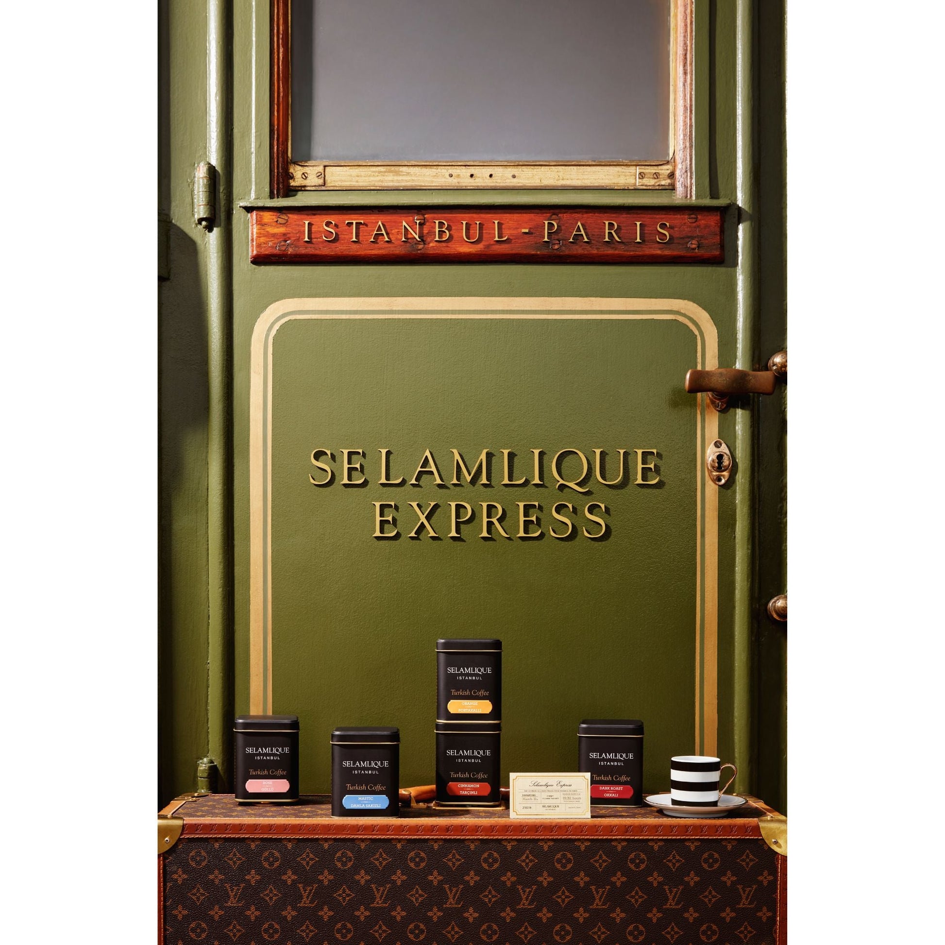 Green door with 'Selamlique Express' branding and tea products displayed below.