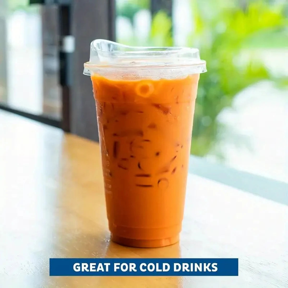Clear plastic cup with iced coffee on a table, with text 'Great for Cold Drinks'.