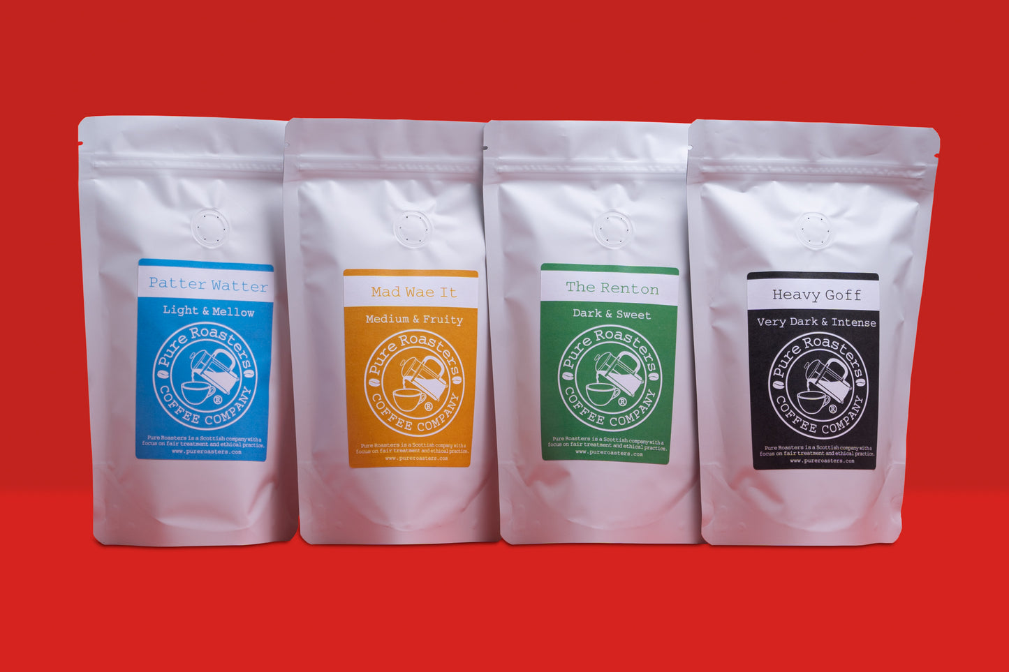 Four coffee bags with different labels on a red background